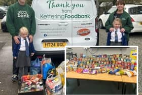 Representatives from Kettering Food Bank receiving the donations from Broughton Primary School