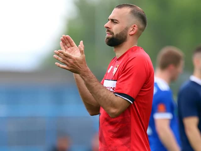 Gary Stohrer applauds the travelling Kettering Town fans after the 1-1 draw at Curzon Ashton, which wasn't enough to seal a play-off place. Picture by Peter Short