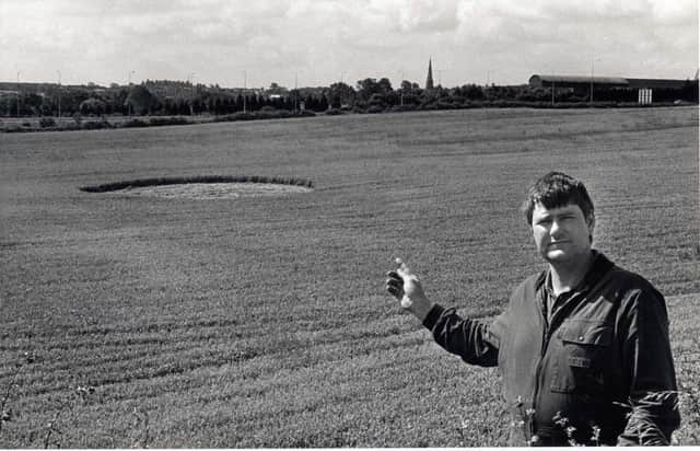 A crop circle near the A45 off Ditchford Lane. Pictured is farmer Dick Sumner in July 30, 1993