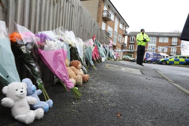 Floral tributes left at the scene in Petherton Court