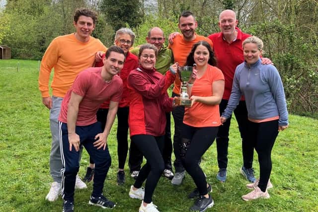 Bright Horizons colleagues with trophy