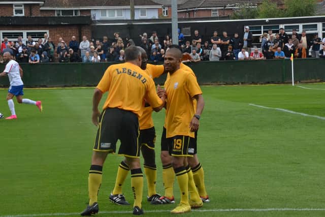 Simeon Jackson takes the congratulations after scoring for the Rushden & Diamonds Legends