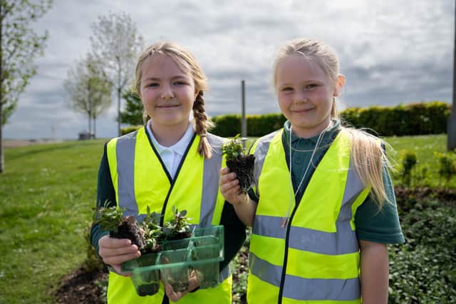 Children from Priors Hall Primary got their hands dirty in the new garden