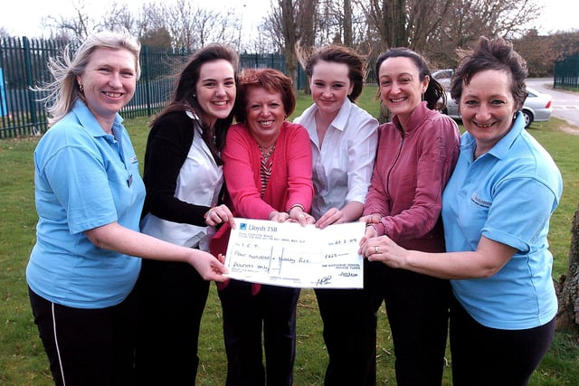 Kingswood Senior School in Corby hands over a cheque to the Integrated Cancer charity following a non-uniform day at the school.  
From left: Karen Dilley, Steph Brown, 16, Ann Smith, Emma Cassie, 13, Hayley Copas and Tessa Day from the charity March 2009