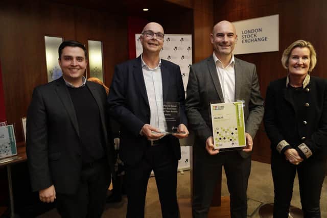 Managing Director Adrian Dennis (middle left) and Sales Director Stuart James (middle right) presented with the national Planet Saver Award at the London Stock Exchange.