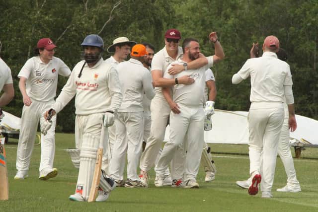 Division 10 leaders Grange Park's celebrate a wicket in their win over Oundle Town IIIs on Saturday (Picture: Finbarr Carroll)