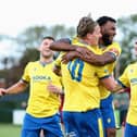 Danny Draper celebrates with his team-mates after scoring Wellingborough's second goal during the Northern Premier League Midland Division match between Wellingborough Town and Grantham Town at The Dog and Duck Stadium. Picture: Rob Webb