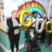 Mrs Emma Jacox with pupils and staff celebrating the 'good' Ofsted grade for Kettering's Hawthorn Community Primary School