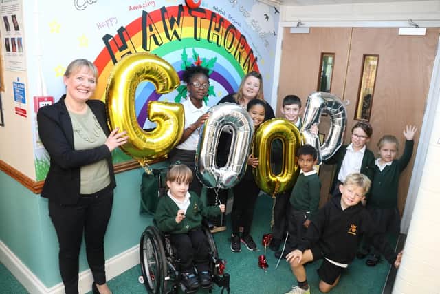Mrs Emma Jacox with pupils and staff celebrating the 'good' Ofsted grade for Kettering's Hawthorn Community Primary School