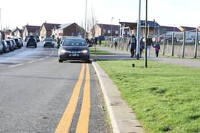 Double yellow lines have been painted on the road near Hayfield Cross School