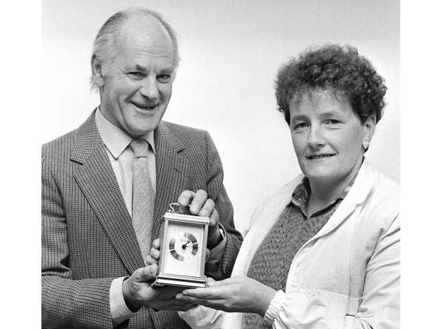1980s and Glennis Hooper is presented a carriage clock