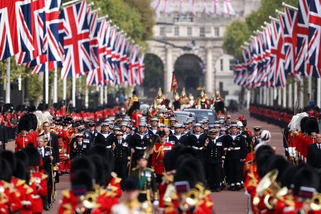 The Coldstream Guards travel along The Mall ahead of the Queen's coffin