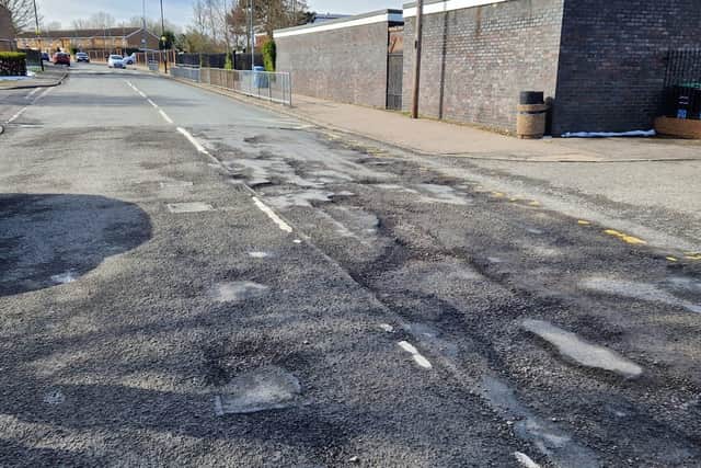 The state of the road outside Lodge Park Academy in Shetland Way