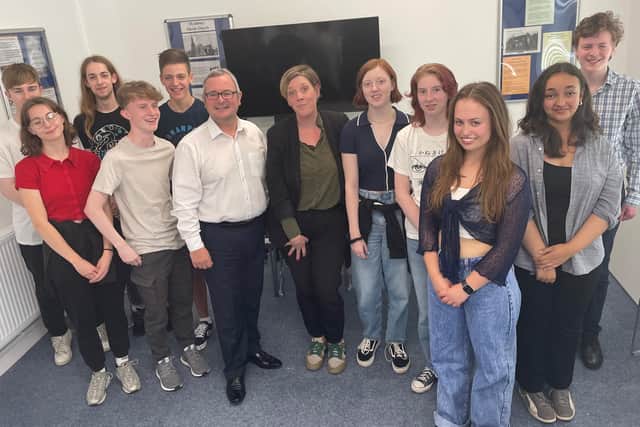 Jess Phillips MP with Corby Labour candidate Lee Barron and members of the Thrapston Youth Forum. Image: NationalWorld