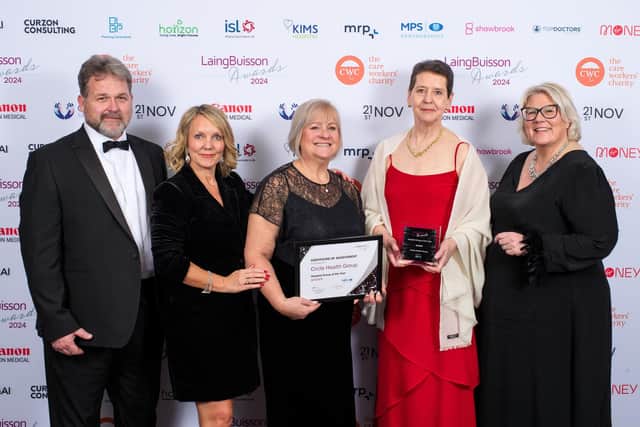 Karen Prins, Chief Operating Officer, with colleagues collecting the award.