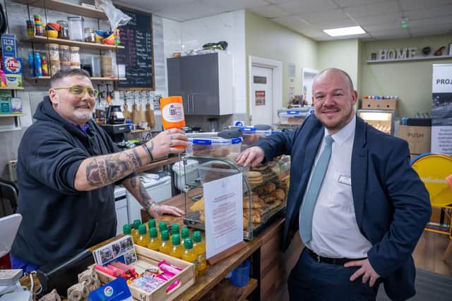 DWSM - SGB-68750 - Stan from Project 16 15 with Shawn from David Wilson Homes in the charity's community cafe