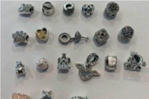 Some of the Pandora charms found. Photo: Northamptonshire Police.
