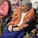 Smiling from the comfort of her seat, Claremont Parkway residents were actively involved with the music