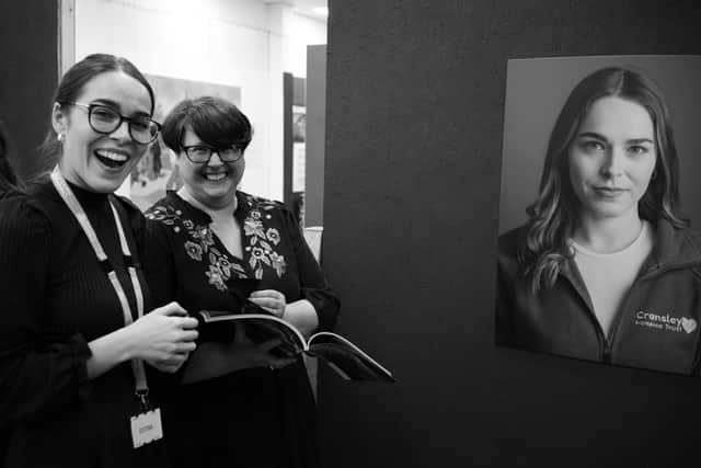 Rebecca Pateman, Digital Marketing Executive for Cransley Hospice Trust, sees her photo at the exhibition.