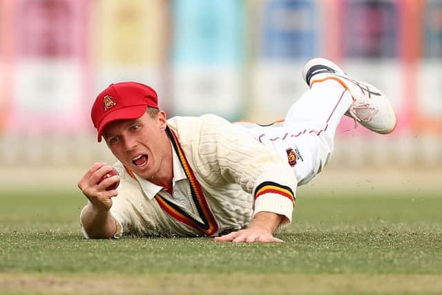 Nathan McSweeney takes a catch to dismiss Victoria's Campbell Kellaway in the Sheffield Shield Final in Melbourne