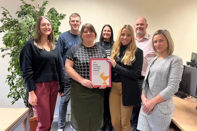 The HR Solutions team with the Feefo Award recognition.