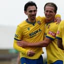 Ethan Johnston (left) of Wellingborough Town celebrates scoring his side's fourth goal against Corby Town on Saturday (Picture: Rob Webb)