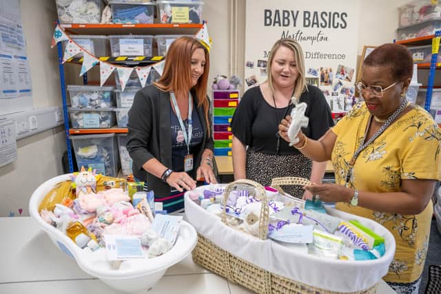 Sabrina Oakey of Baby Basics (L), showing Gemma and Karen an essential starter pack