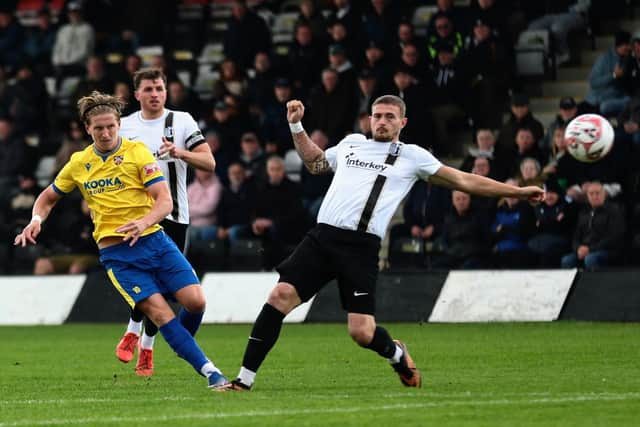 Danny Draper fires home Wellingborough Town's opening goal against Corby Town (Picture: Rob Webb)