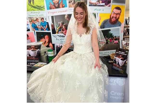 Bride-to-be Beckie Cave in one of the bridal gowns on sale at Cransley Hospice charity shop