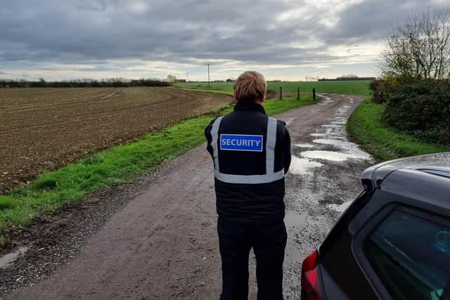 A security guard outside one of the turkey farms near Oundle where avian (bird) flu was detected.