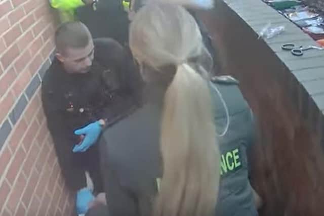 Quick-thinking by police officer saves man's life in Kettering  - emergency services on the scene /Northants Police