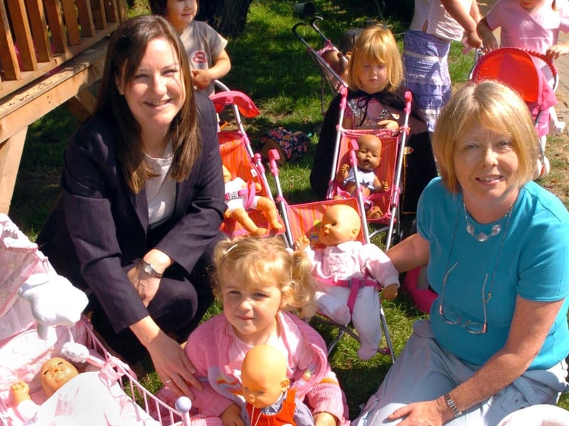 A donation of toys by Zapf in 2006. Pictured are Zapf Creation marketing manager Vicky Colburn, Jessica Shipp, 3, and deputy head Katey Mairs.
