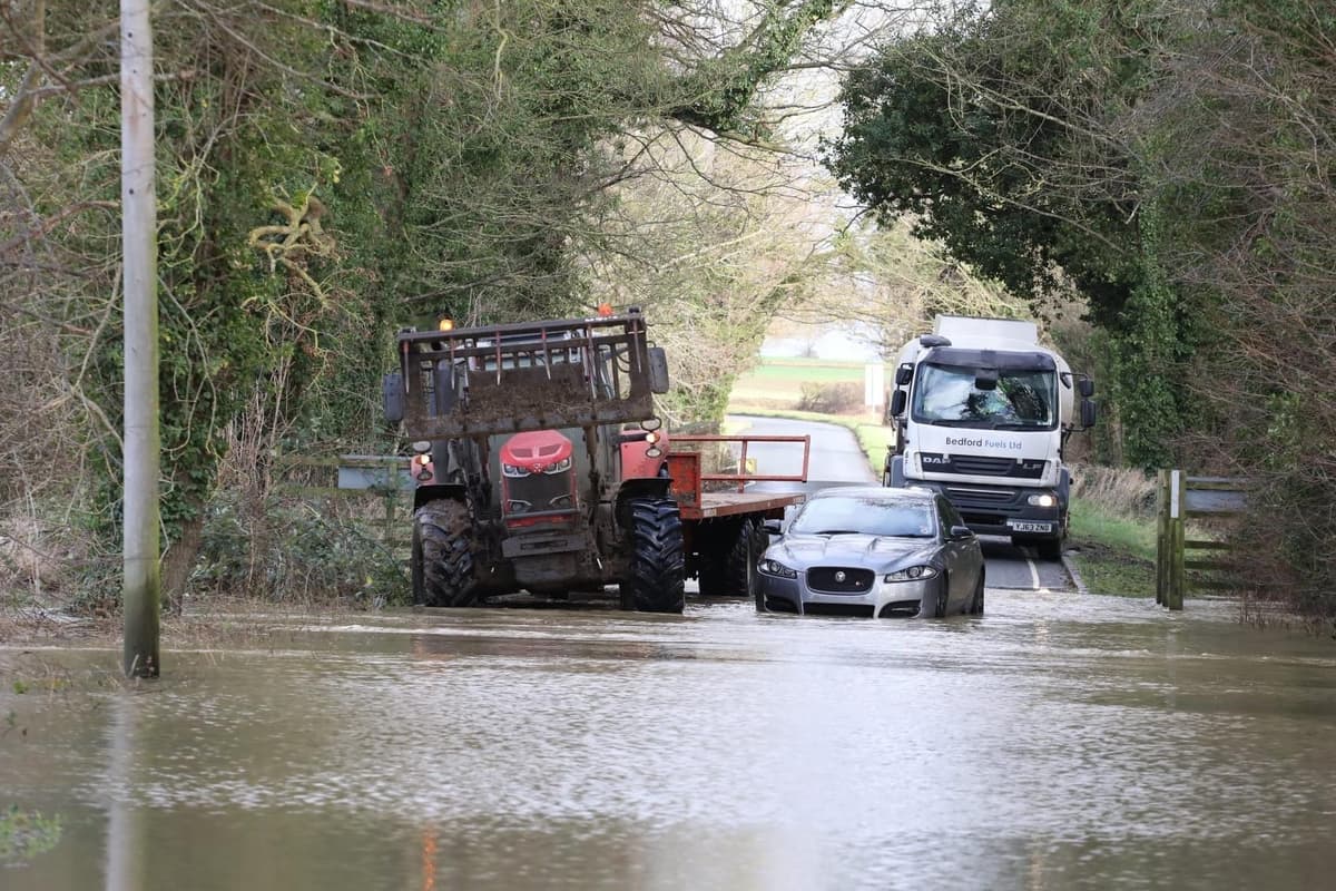 PICTURES: Flood water 'remains high' as villages cut off to car traffic as River Nene floods after storm 