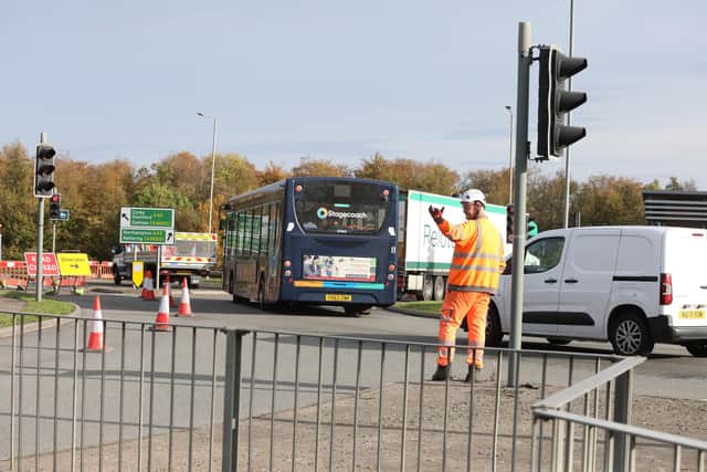 Motorists were assisted by highways workers after traffic lights stuck on red/IMG