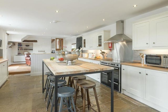 A large, open plan kitchen diner; a great entertaining space also benefiting from a casual seating area with a wood burner. The kitchen currently allows seating for 16.
