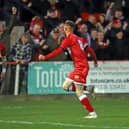 Connor Kennedy heads off to celebrate after he scored the opening goal in Tuesday's win over York City