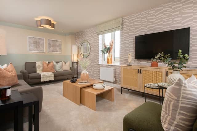BN - The living room inside the Hertford show home at Priors Hall Park in Northamptonshire