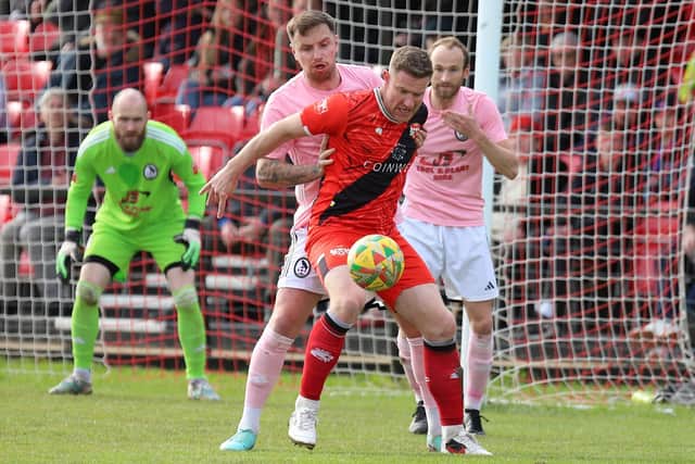 Kelvin Langmead shields the ball during Kettering's 1-0 win over Coalville Town (Picture: Peter Short)