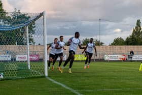 Khristopher Oti celebrates the first of his three goals in Corby Town's 6-0 win at Rugby Town. Pictures by Jim Darrah