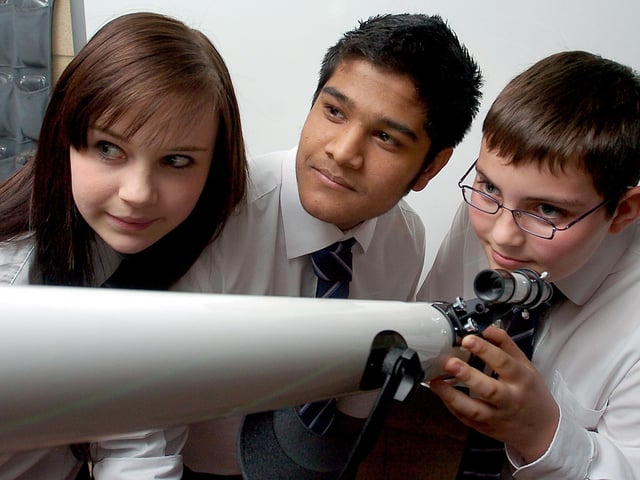 Pupils Cassandra Shipley, 15, Sultan Chaudhury, 15 and Matthew Atkin, 14 received a free telescop to mark 400 years since Galileo first looked at the moon