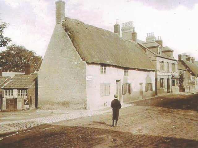 Junction of Duck Street and High Street, Rushden, in early 1890s. First building is two shops - a greengrocers and a fish shop. Next door is The New Inn. This later became the Railway Inn after the railway came to the town in about 1892/3 (picture originally supplied by Eric Fowell)