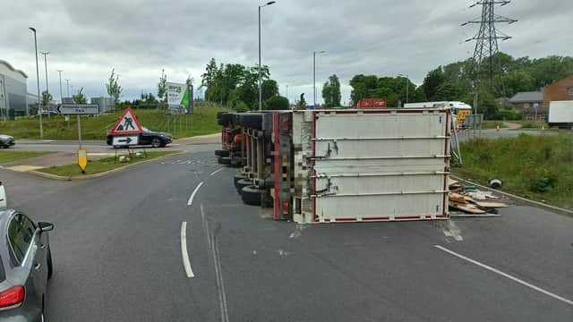 The overturned lorry.