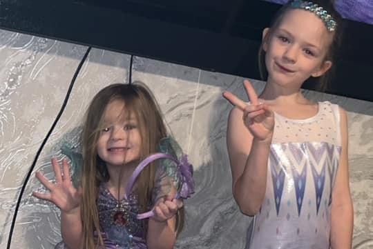 Maddi and Maya, age 3 and 8, from Higham Ferrers, as mermaid and gymnasts