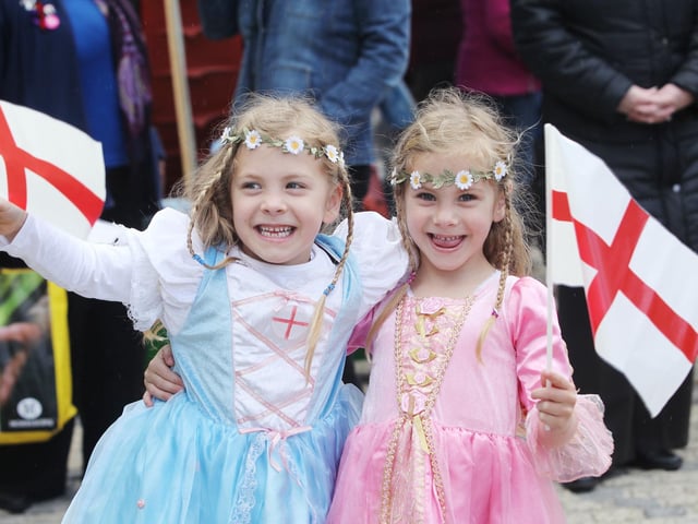 Twins Megan and Tamzin Rowthorn, age five, celebrate St George's Day in Rushden town centre 2012