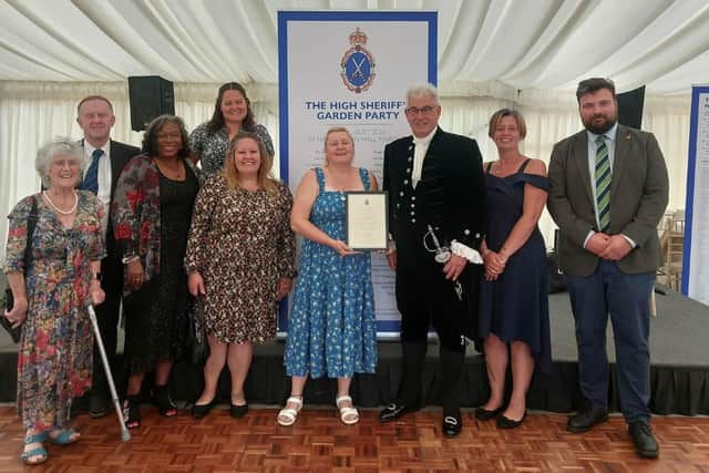Kelly Mercer receiving her award from the High Sheriff of Northamptonshire Roger Butler
