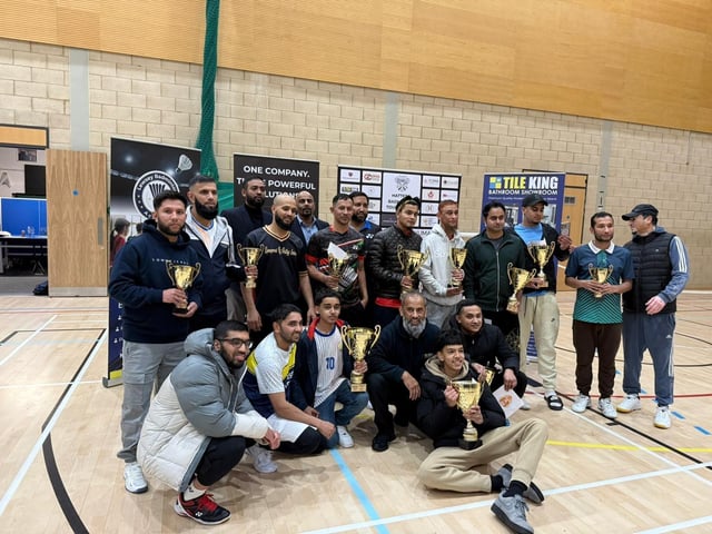Players celebrating together at the Hatters Badminton Tournament 2025 after a day of competitive and enjoyable matches.