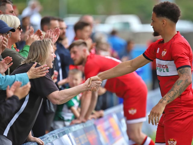 Rhys Sharpe is consoled on by some fans at the end