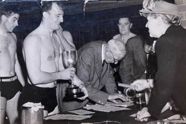 Charles Jacques of the Kaycee factory team receiving the trophy in the 1960s