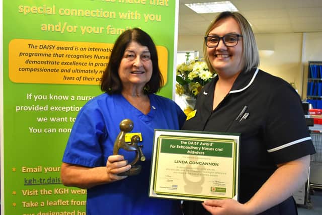 Linda Concannon receives her award from Head of Midwifey Kerry Williams.