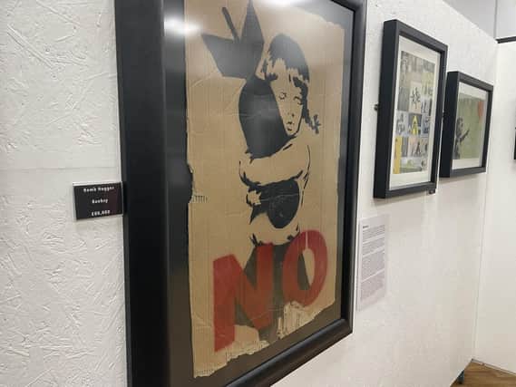 Bomb Hugger, painted by Banksy for an anti-war demo, is one of the exhibits at the Corby Rooftop Arts Gallery.